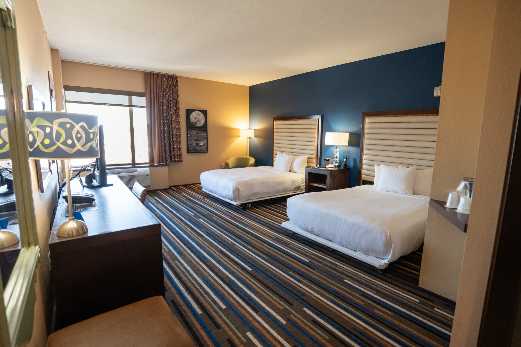 The interior of a double queen boutique hotel room at the Moonrise Hotel in the Delmar Loop