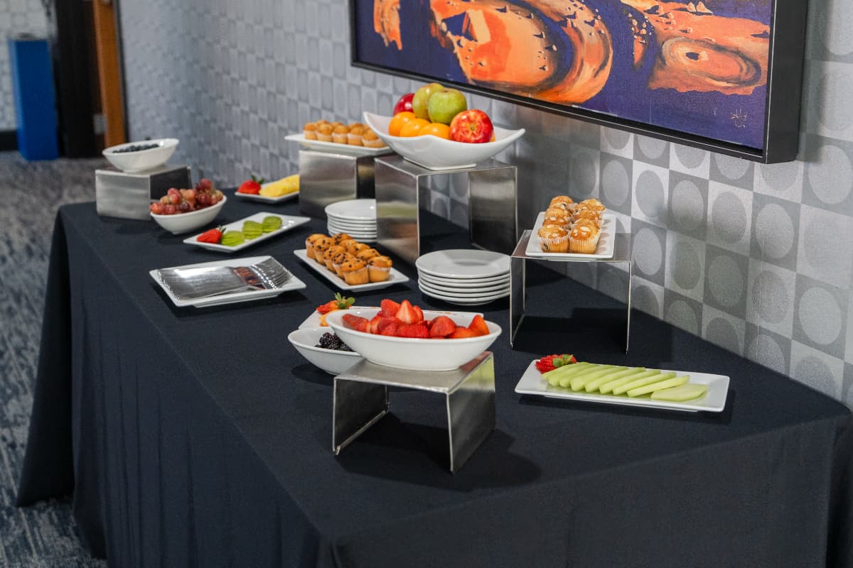 fruit and muffin spread A fruit and muffin buffet table.